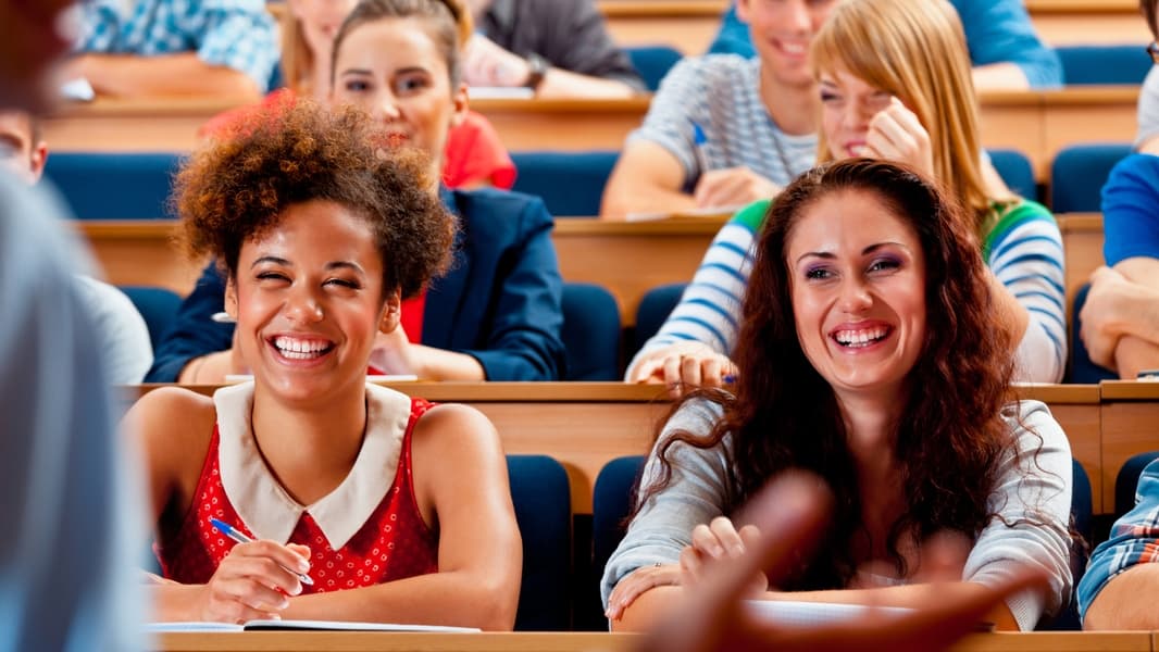 Students in lecture hall - stock photo